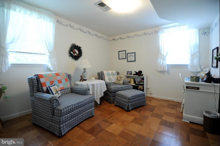 6505 Divine Street McLean, VA 22101 - Photo 10 of 26 a living room with furniture and a window