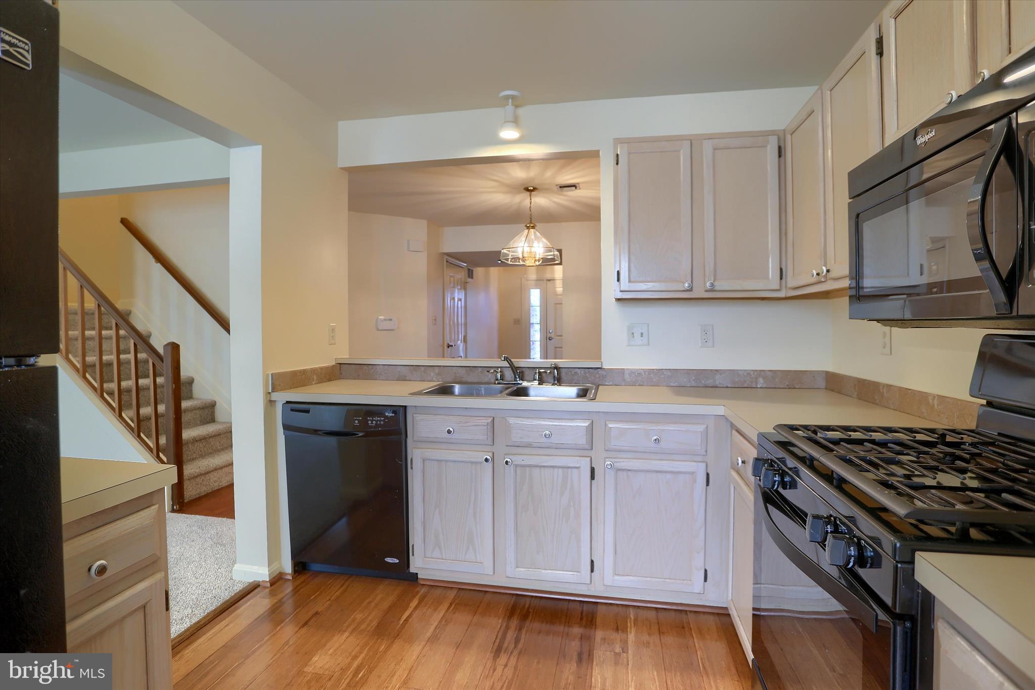 107 Fawn Ridge North Harrisburg, PA 17110 - Photo 12 of 40 a kitchen with cabinets appliances and a wooden floor