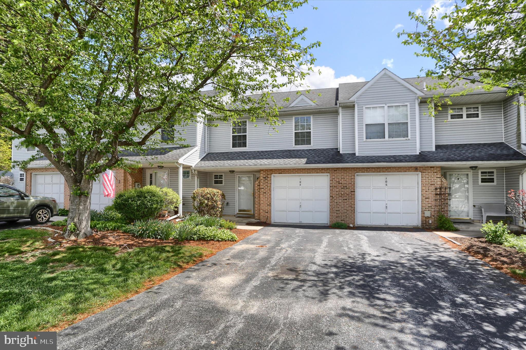 107 Fawn Ridge North Harrisburg, PA 17110 - Photo 2 of 40 a front view of a house with a yard and garage