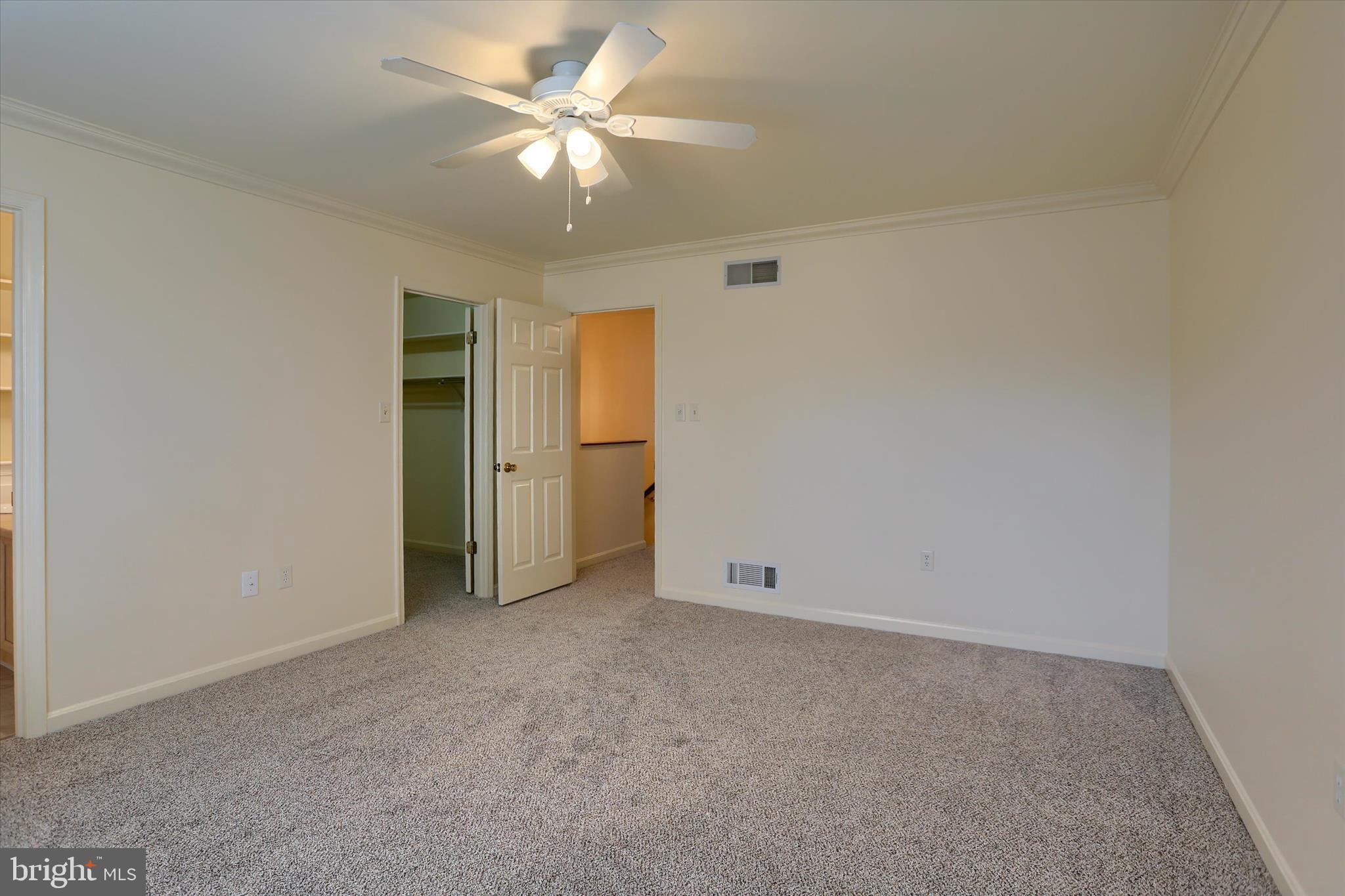 107 Fawn Ridge North Harrisburg, PA 17110 - Photo 27 of 40 an empty room with closet and a ceiling fan