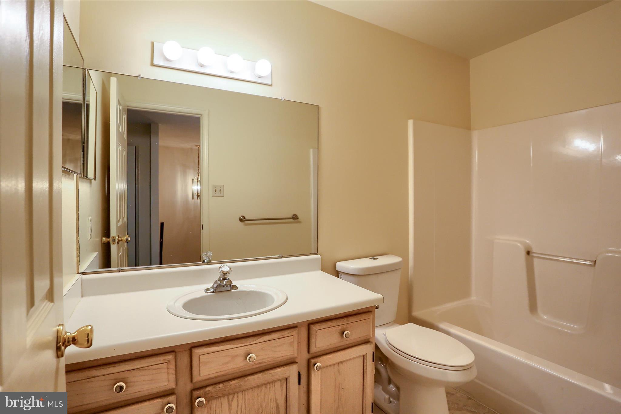107 Fawn Ridge North Harrisburg, PA 17110 - Photo 29 of 40 a bathroom with a sink a toilet and a mirror