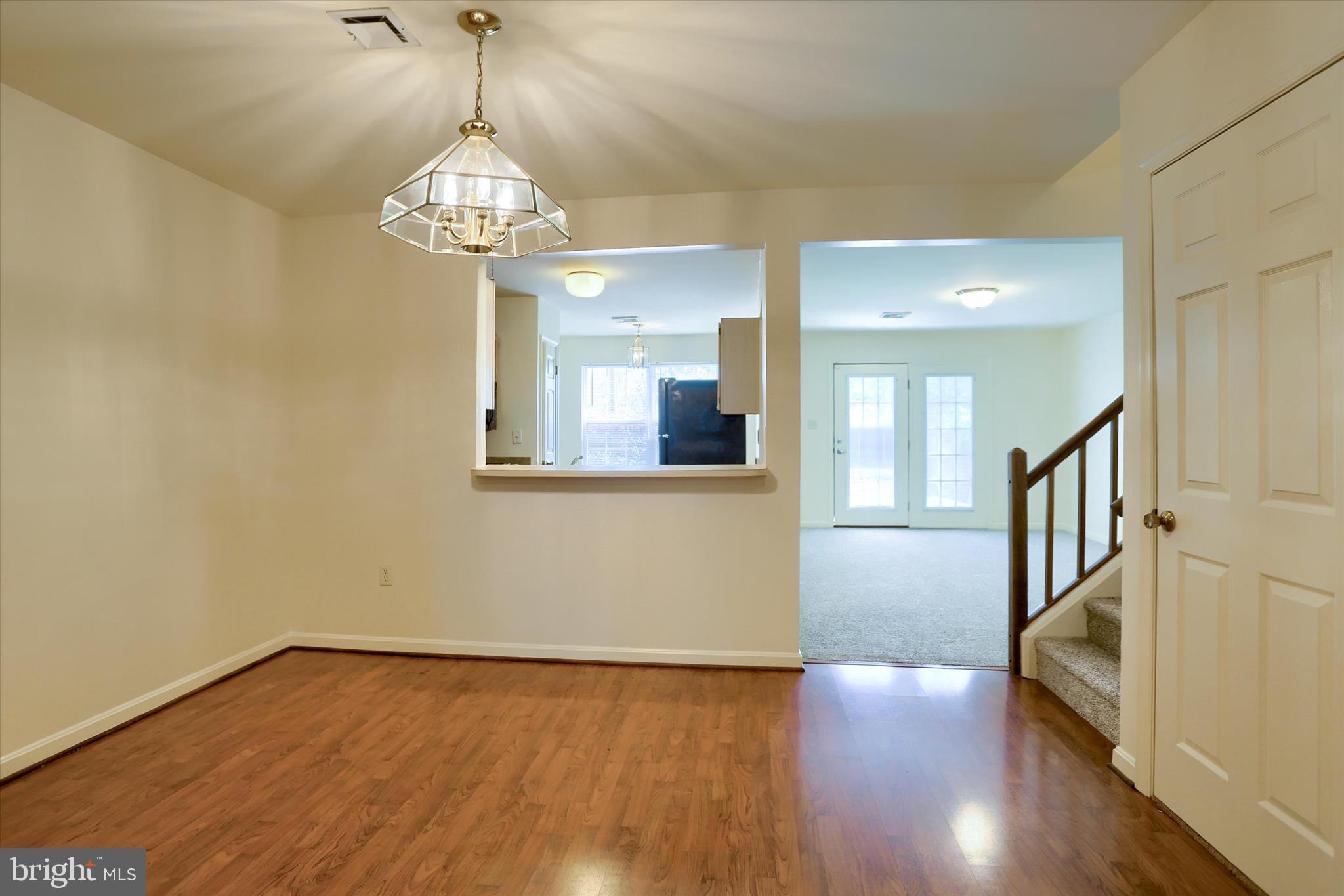 107 Fawn Ridge North Harrisburg, PA 17110 - Photo 9 of 40 a view of a room with wooden floor chandelier and windows