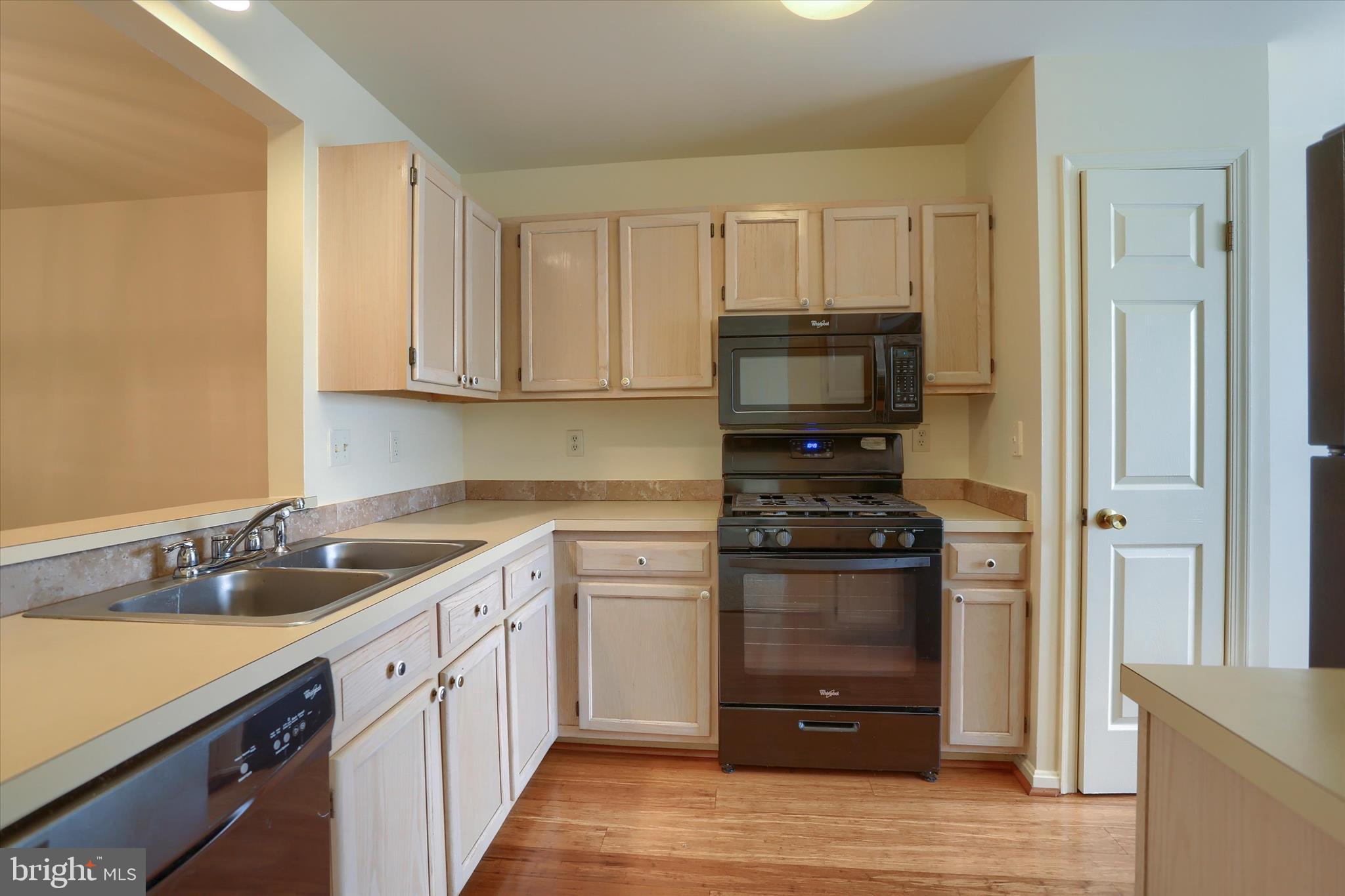 107 Fawn Ridge North Harrisburg, PA 17110 - Photo 10 of 40 a kitchen with stainless steel appliances granite countertop a stove and a refrigerator