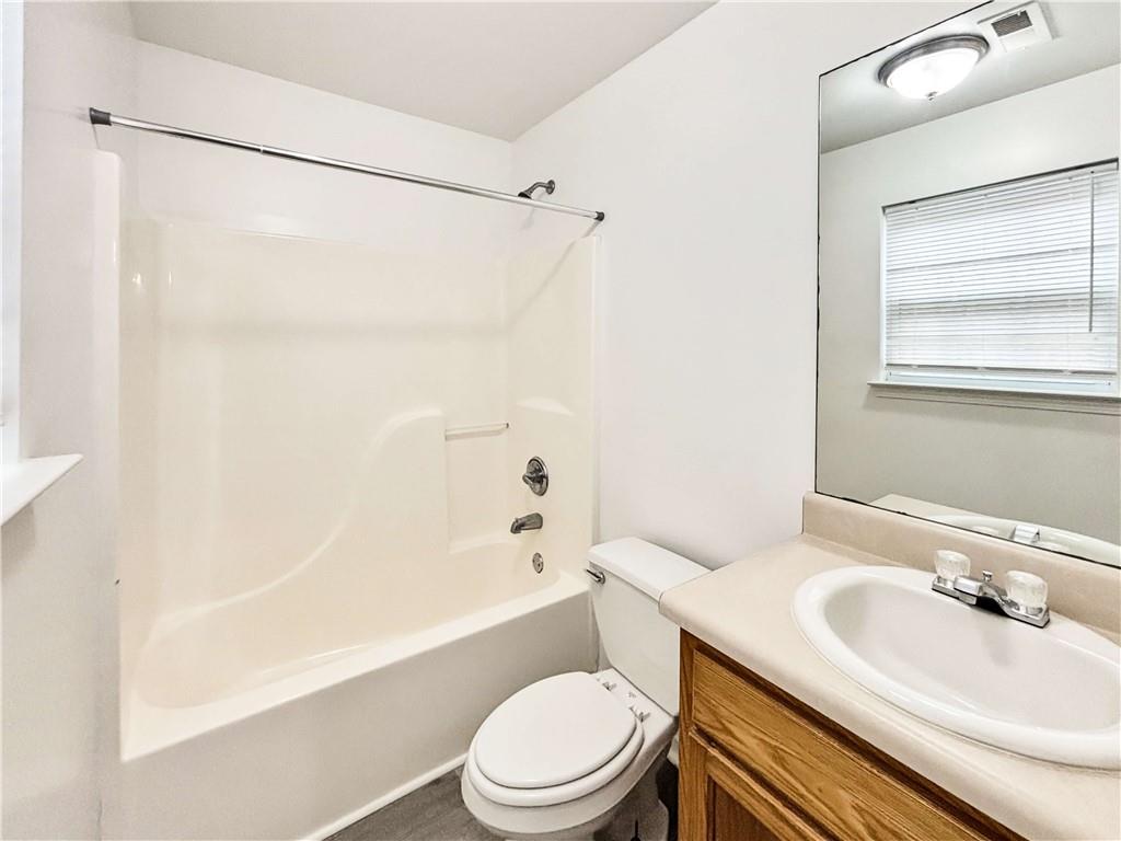 1400 Stonehaven Circle, Unit 1402 Cartersville, GA 30121 - Photo 13 of 23 a bathroom with a sink toilet and shower