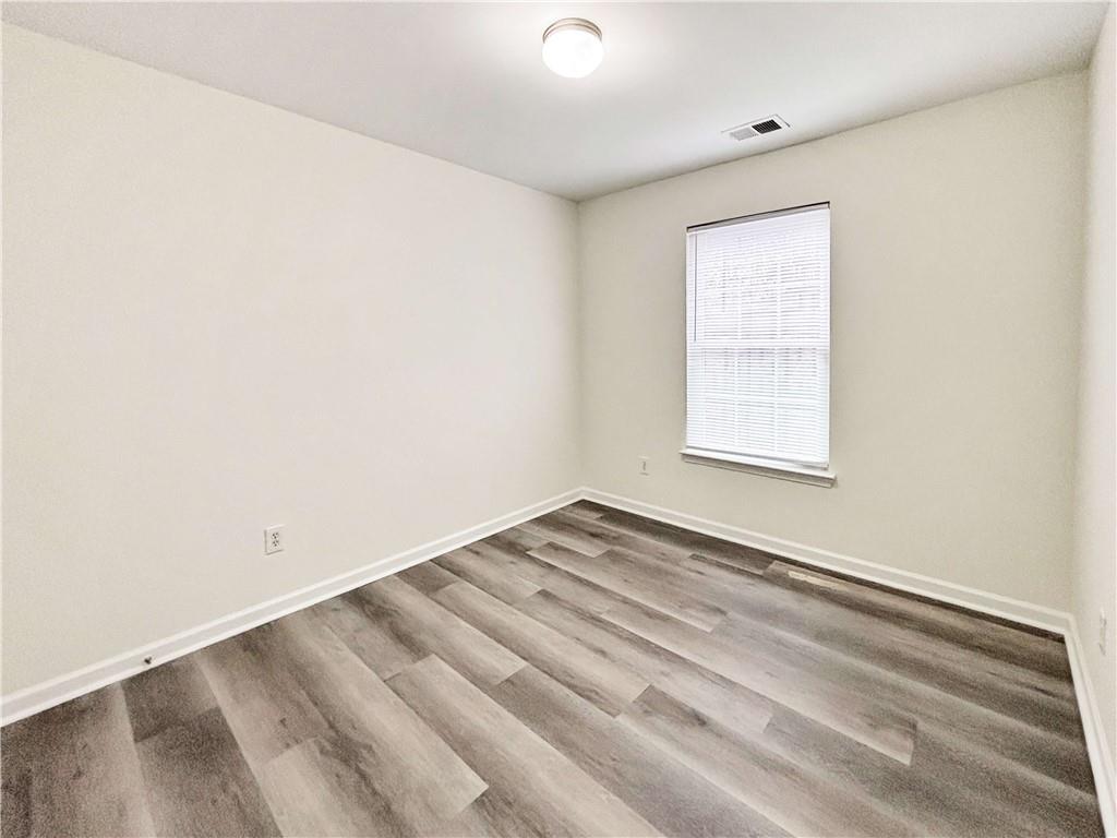 1400 Stonehaven Circle, Unit 1402 Cartersville, GA 30121 - Photo 17 of 23 an empty room with a window