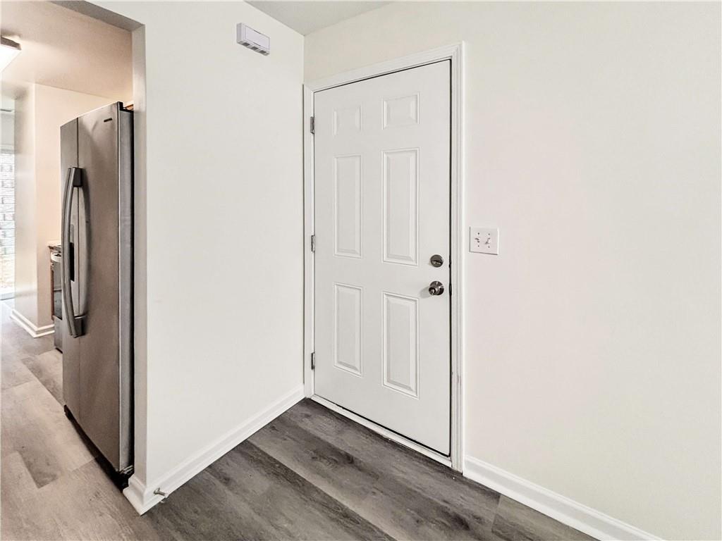1400 Stonehaven Circle, Unit 1402 Cartersville, GA 30121 - Photo 3 of 23 a view of a hallway with wooden floor