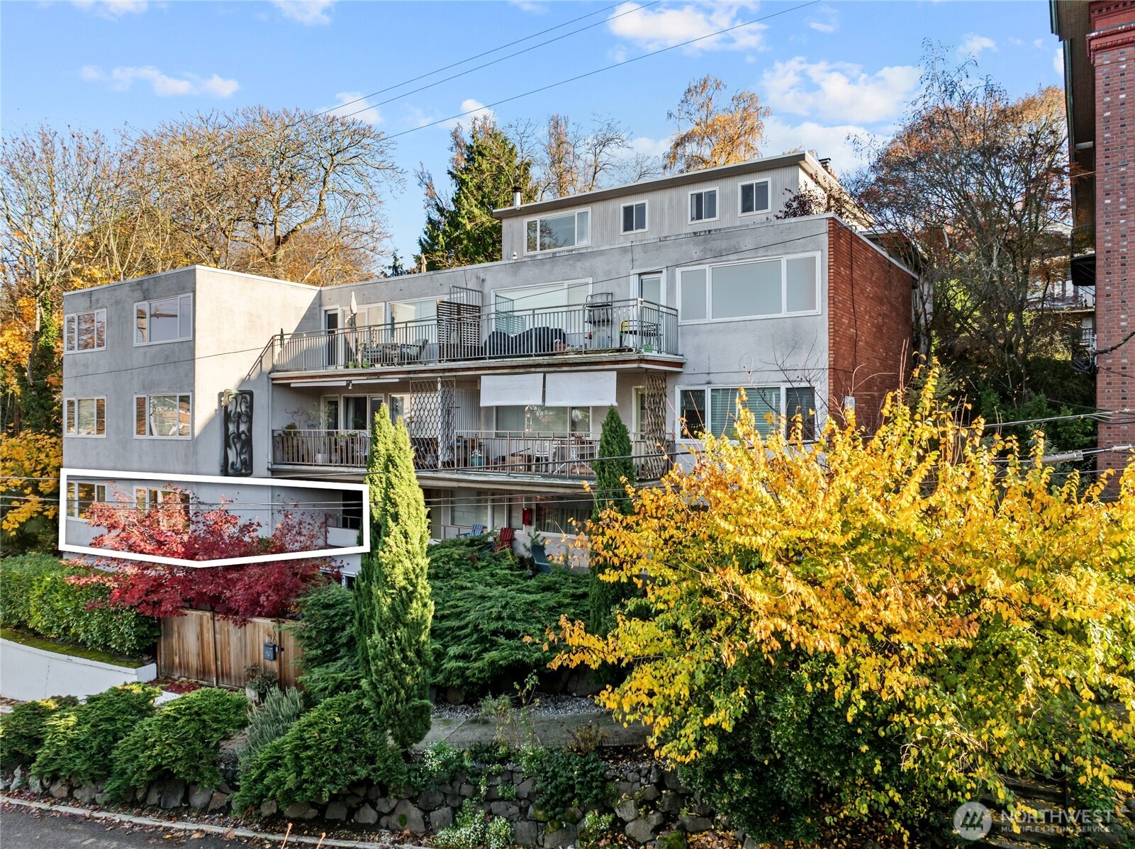 an aerial view of a house with a yard and fountain