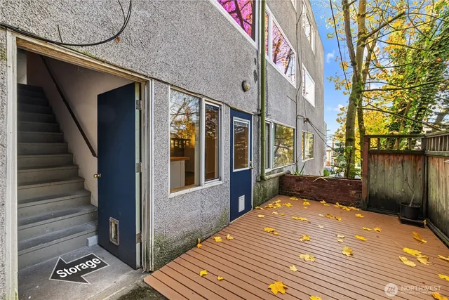 a view of a house with a wooden deck