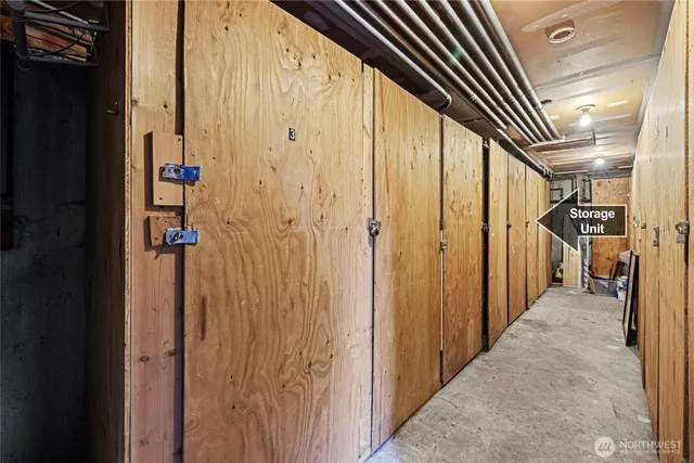 a view of a hallway with wooden shelves