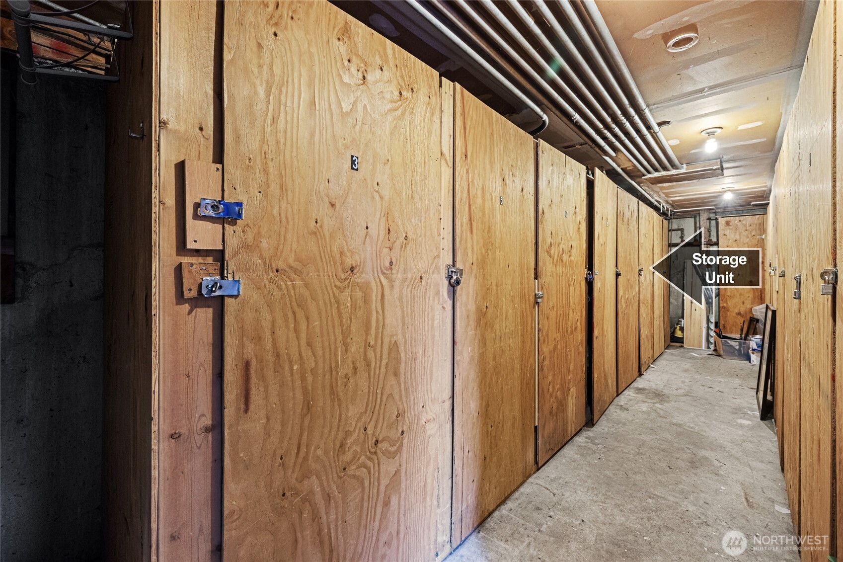 634 13th Avenue East, Unit 17 Seattle, WA 98102 - Photo 25 of 39 a view of a hallway with wooden shelves
