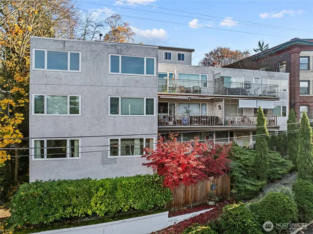 an aerial view of a house with balcony and garden