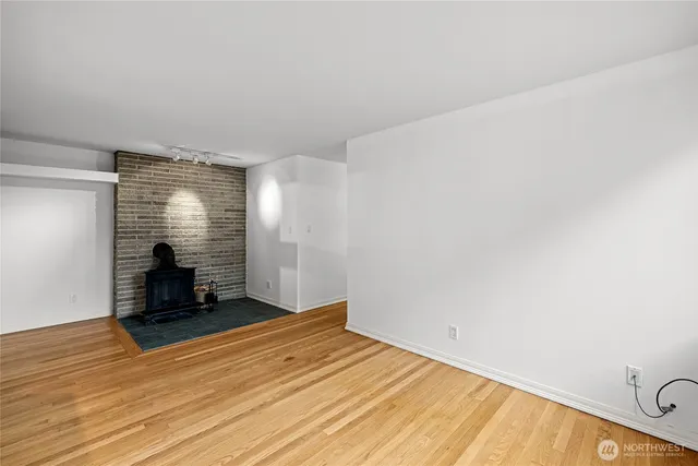 a view of a room with wooden floor