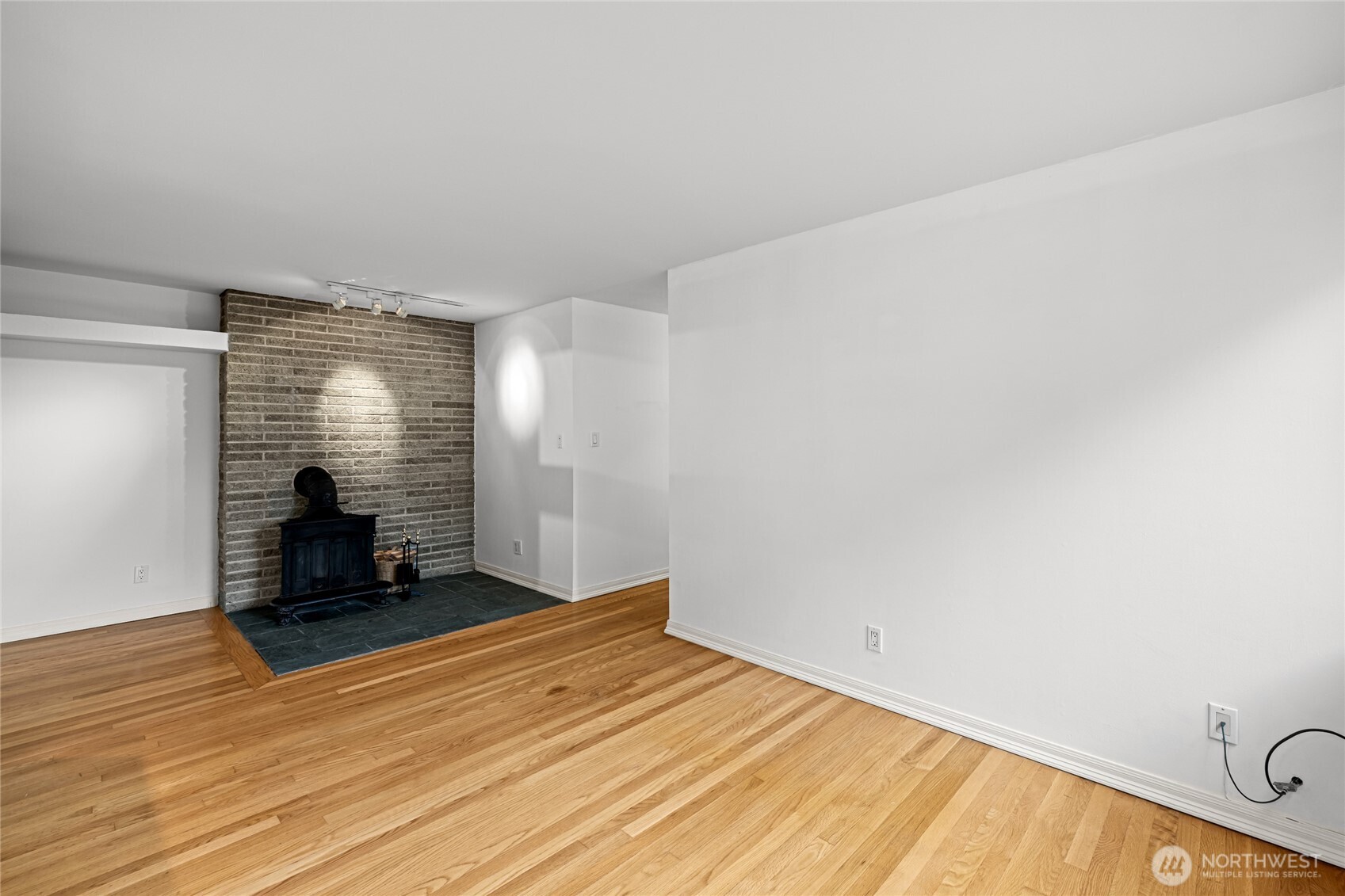 634 13th Avenue East, Unit 17 Seattle, WA 98102 - Photo 8 of 39 a view of a room with wooden floor