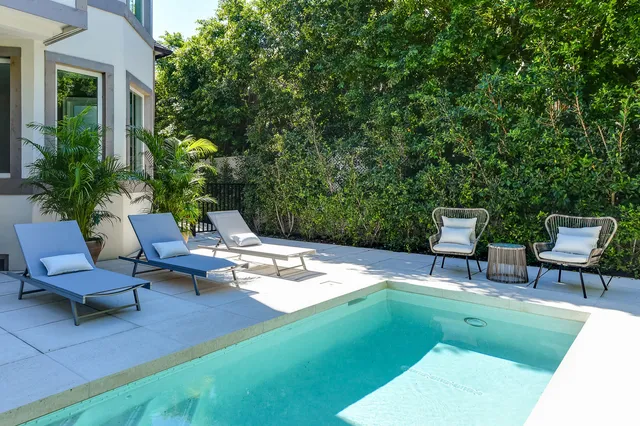 a view of a backyard with sitting area