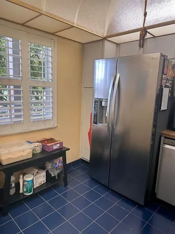 a view of a livingroom with furniture and a window