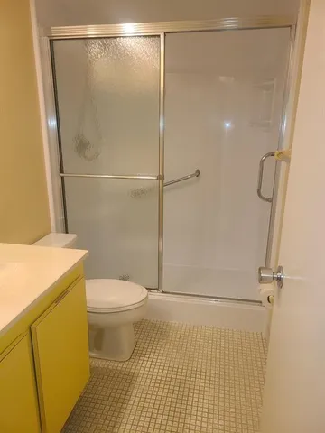 a view of a hallway view with wooden floor and staircase