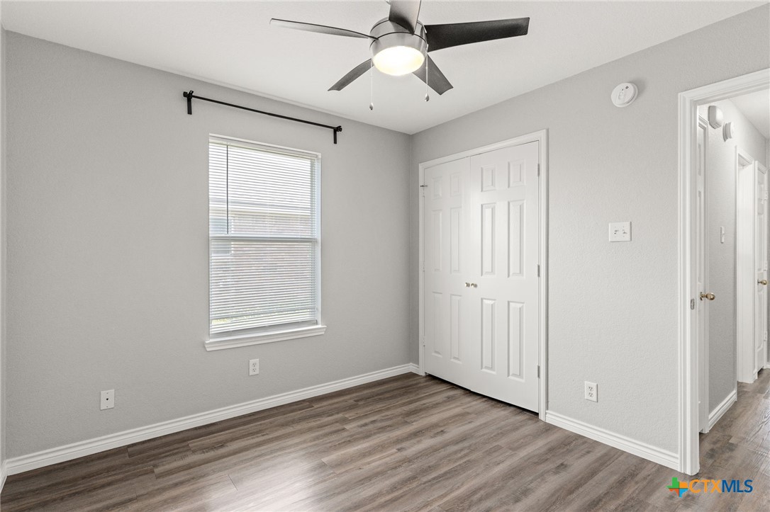 4305 Maggie Drive Killeen, TX 76549 - Photo 13 of 14 a view of an empty room with wooden floor and a window