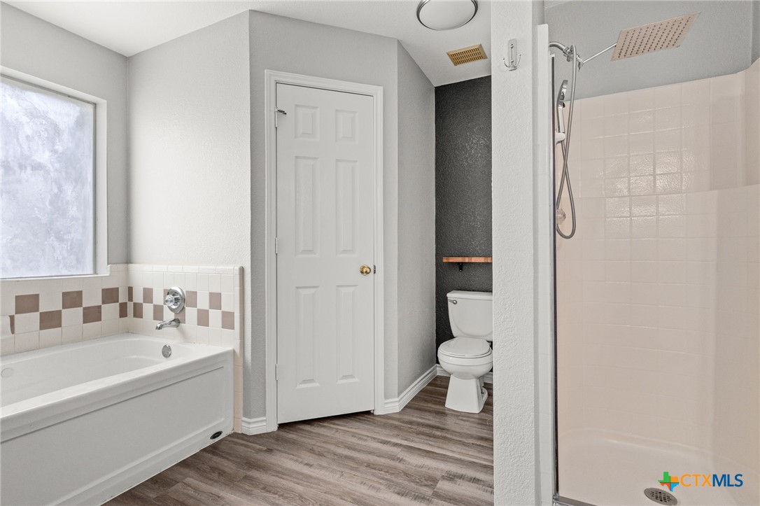 4305 Maggie Drive Killeen, TX 76549 - Photo 7 of 14 a bathroom with a sink a toilet and shower