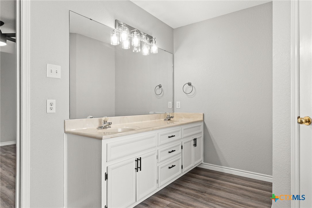 4305 Maggie Drive Killeen, TX 76549 - Photo 8 of 14 a bathroom with a double vanity sink and a mirror