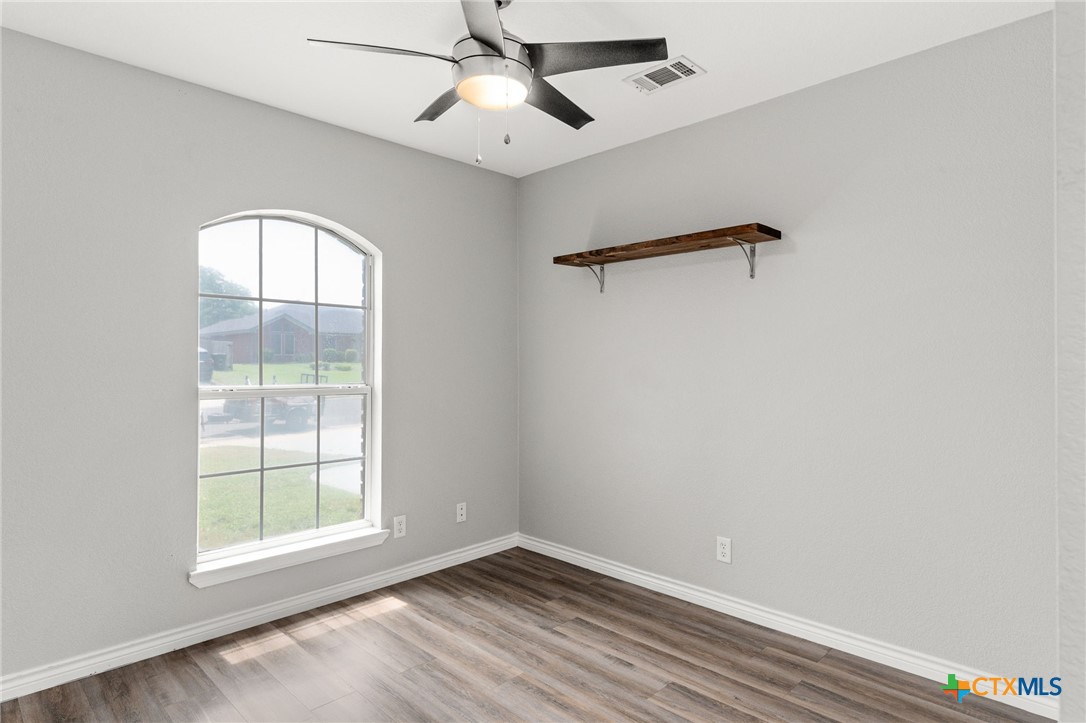 4305 Maggie Drive Killeen, TX 76549 - Photo 10 of 14 an empty room with windows and fan