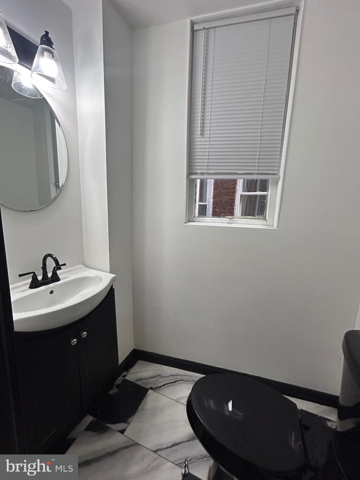 2739 Riggs Avenue Baltimore, MD 21216 - Photo 8 of 21 half bath on main level