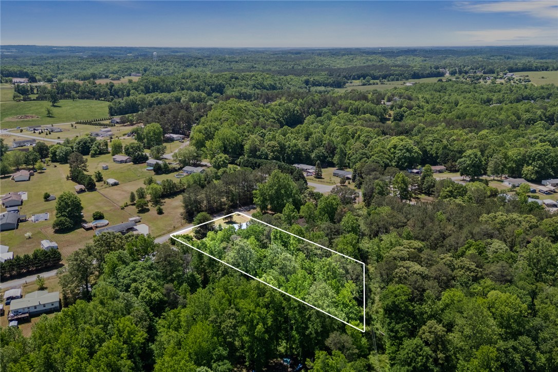 209 Short Cut Road Westminster, SC 29693 - Photo 8 of 27 This verdant expanse offers a serene landscape, perfect for building your dream retreat.