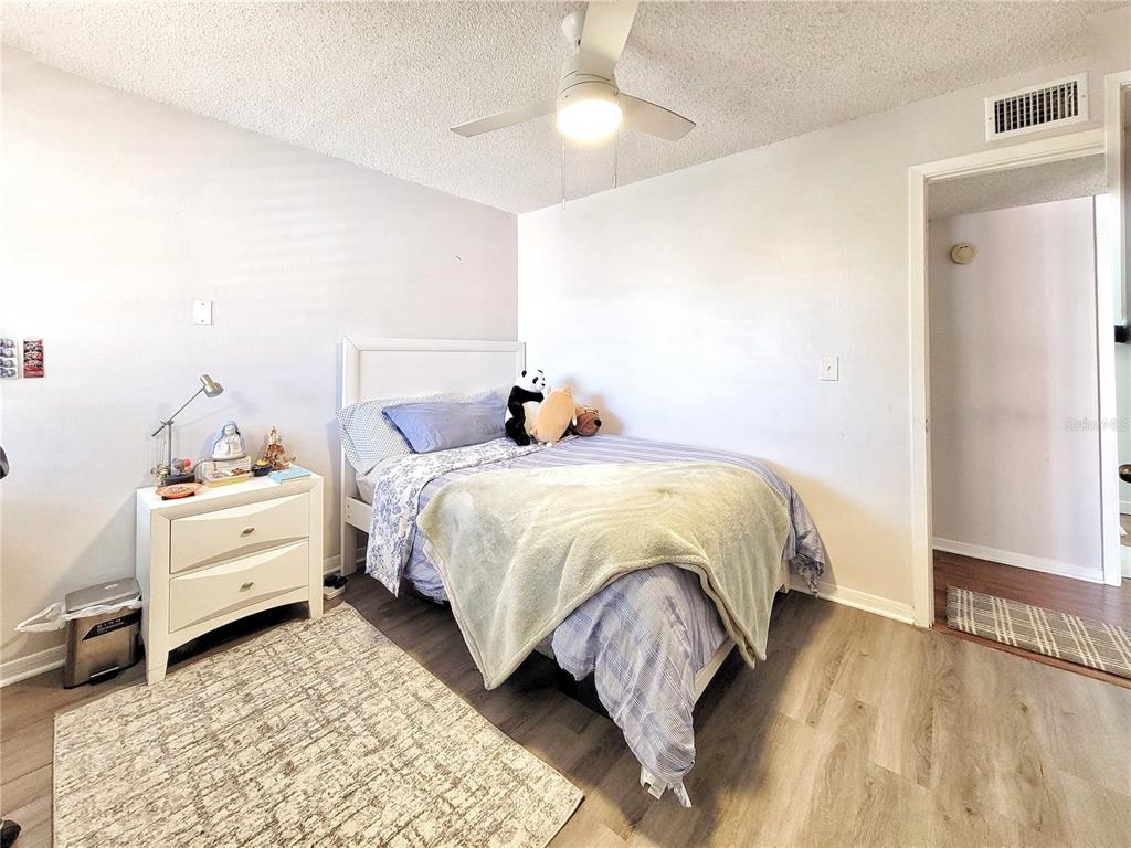 2601 Southwest Archer Road, Unit H330 Gainesville, FL 32608 - Photo 11 of 28 a bed room with a bed and a baby crib