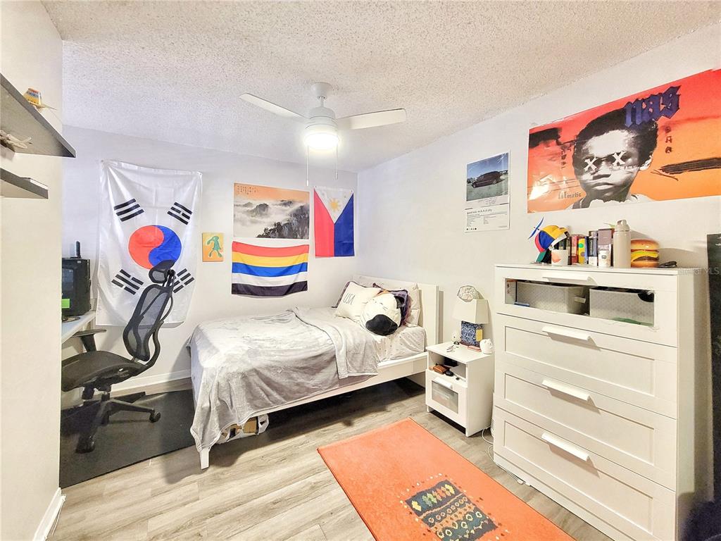 2601 Southwest Archer Road, Unit H330 Gainesville, FL 32608 - Photo 12 of 28 a bedroom with a bed and a desk