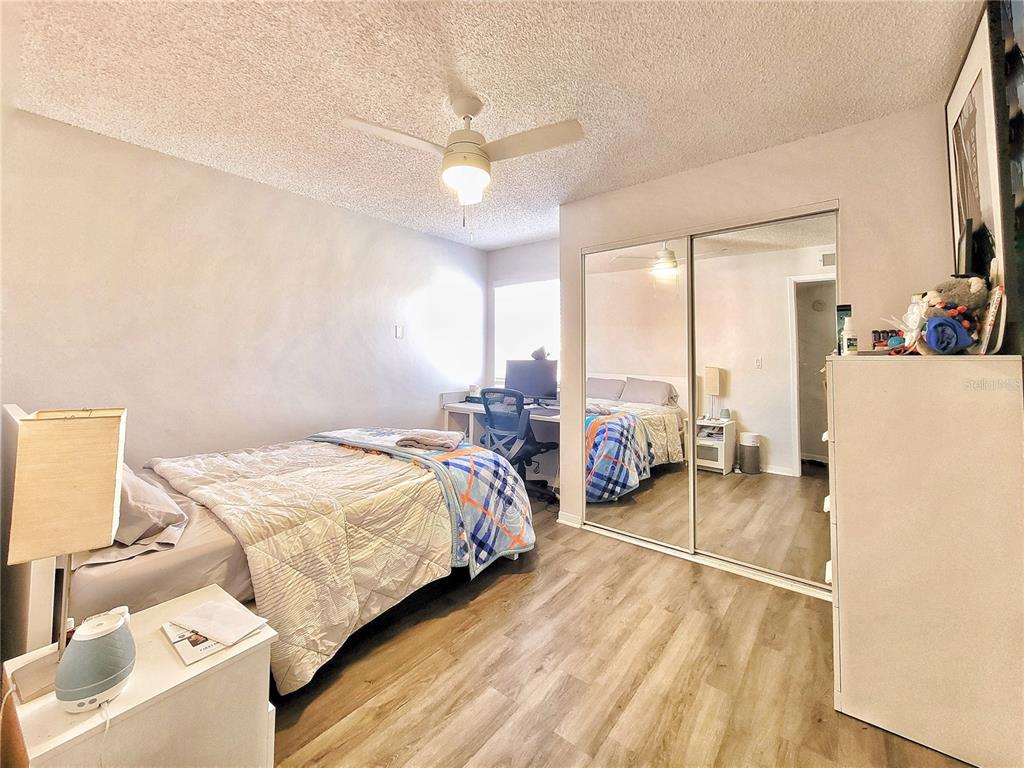 2601 Southwest Archer Road, Unit H330 Gainesville, FL 32608 - Photo 19 of 28 a bed room with a bed and a television