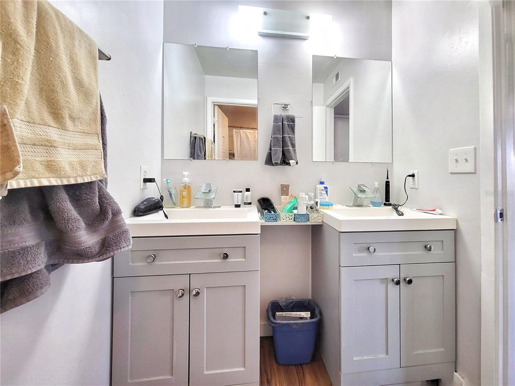 2601 Southwest Archer Road, Unit H330 Gainesville, FL 32608 - Photo 22 of 28 a bathroom with a sink double vanity and a mirror