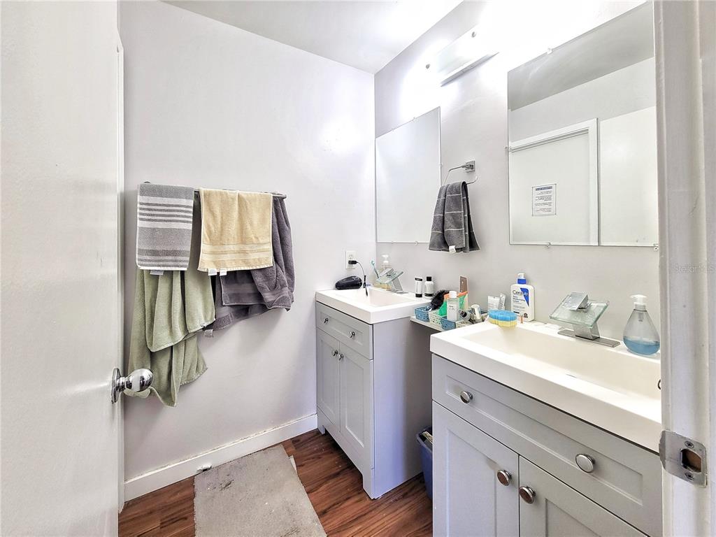 2601 Southwest Archer Road, Unit H330 Gainesville, FL 32608 - Photo 23 of 28 a bathroom with a sink vanity and mirror