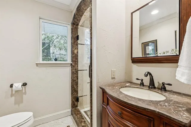 an aerial view of residential houses with outdoor space and street view