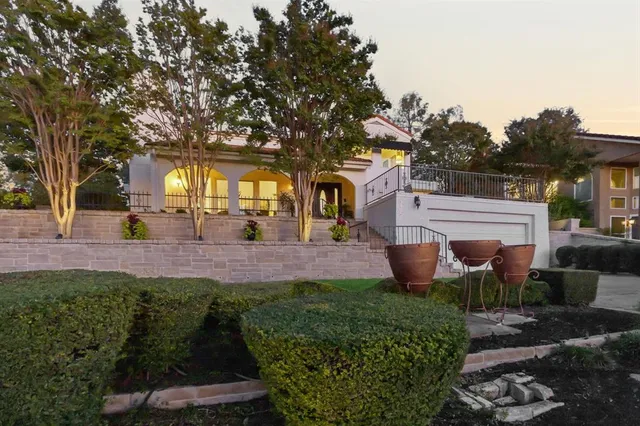a living room with fireplace furniture and a wooden floor