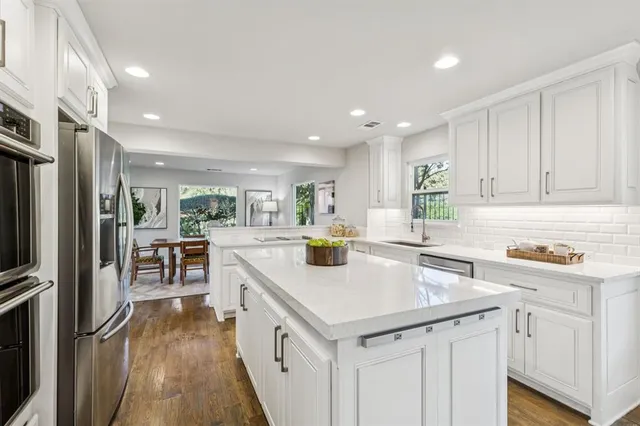 a bathroom with a granite countertop shower a mirror and a sink