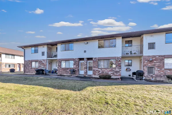 a swimming pool view with a outdoor seating space