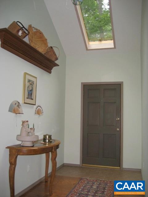 25 Dogleg Road Palmyra, VA 22963 - Photo 5 of 20 Spacious light-filled foyer with skylight. Hardwood floors in the foyer, dining room, kitchen and hall.