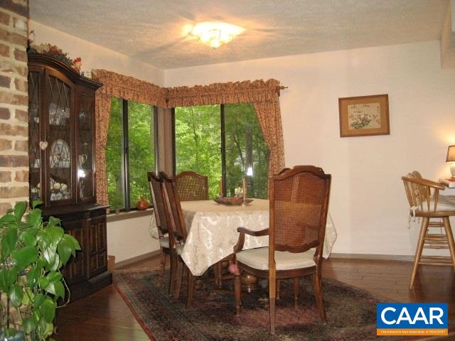 25 Dogleg Road Palmyra, VA 22963 - Photo 8 of 20 Dining room with hardwood floors and oversized windows with beautiful views to the backyard privacy.