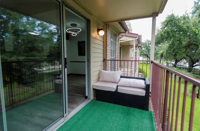 a balcony view with a garden space