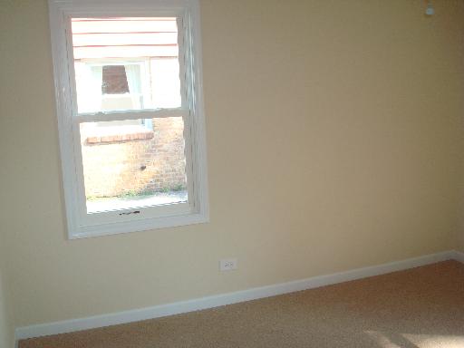 11017 Mayfield Avenue Chicago Ridge, IL 60415 - Photo 7 of 13 an empty room with a window
