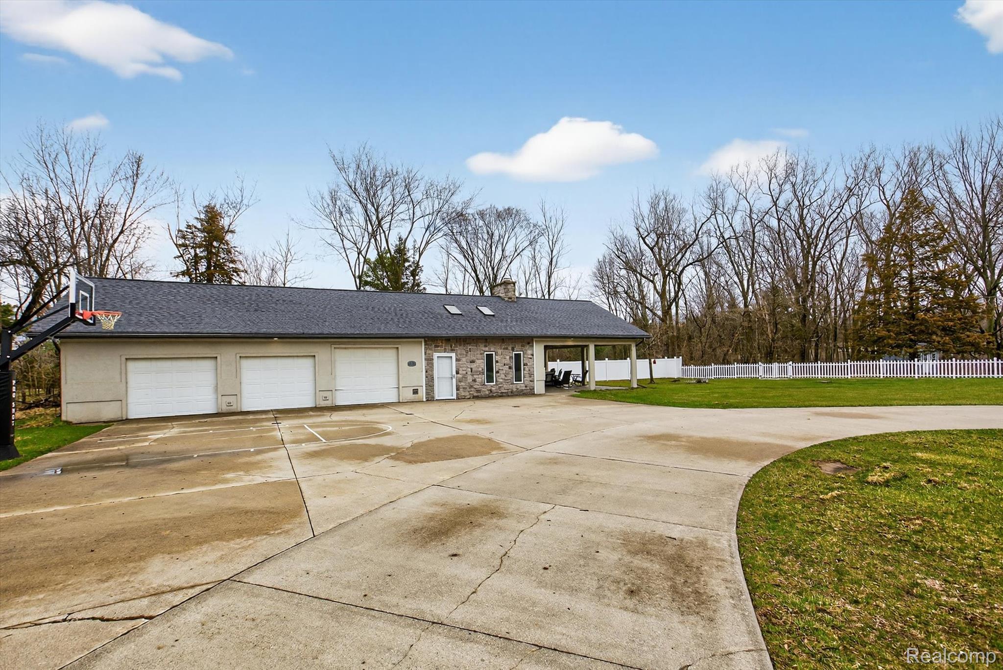 552 North McKinley Road Flushing, MI 48433 - Photo 76 of 98 Single story home featuring concrete driveway, a chimney, a garage, stone siding, and covered porch