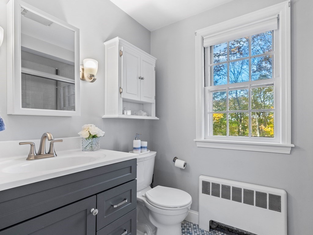31 Bay State Road Wellesley, MA 02481 - Photo 15 of 24 a bathroom with a sink a toilet and a window