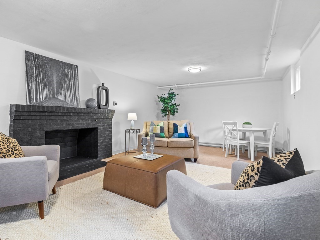 31 Bay State Road Wellesley, MA 02481 - Photo 19 of 24 a living room with furniture and a fireplace