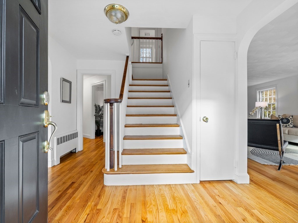 31 Bay State Road Wellesley, MA 02481 - Photo 2 of 24 a view of a livingroom with wooden floor and stairs