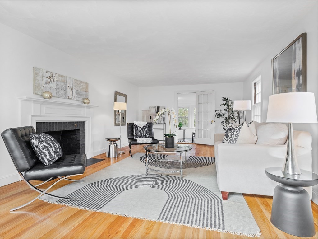 31 Bay State Road Wellesley, MA 02481 - Photo 3 of 24 a living room with furniture and a fireplace