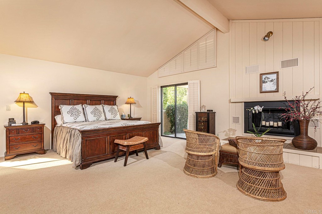16854 Los Morros Rancho Santa Fe, CA 92067 - Photo 15 of 40 a bedroom with furniture and a fireplace