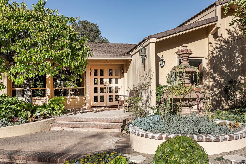 16854 Los Morros Rancho Santa Fe, CA 92067 - Photo 2 of 40 a front view of a house with garden