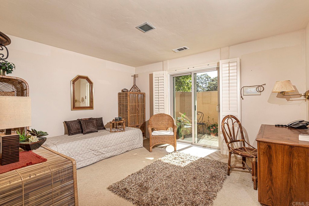 16854 Los Morros Rancho Santa Fe, CA 92067 - Photo 22 of 40 a bedroom with furniture and a window