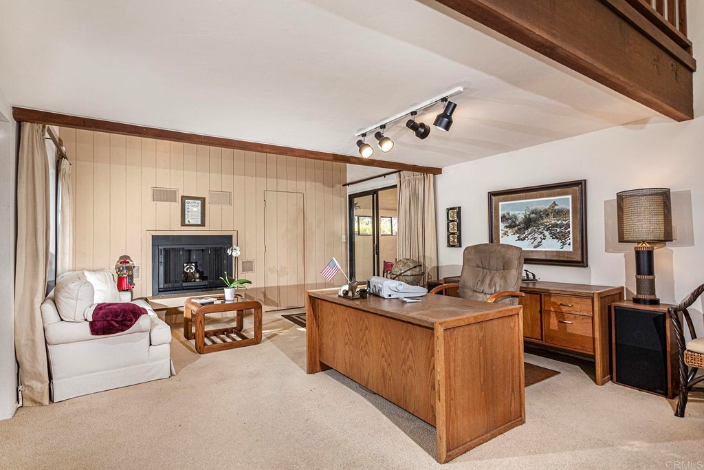 16854 Los Morros Rancho Santa Fe, CA 92067 - Photo 26 of 40 a living room with furniture and a fireplace