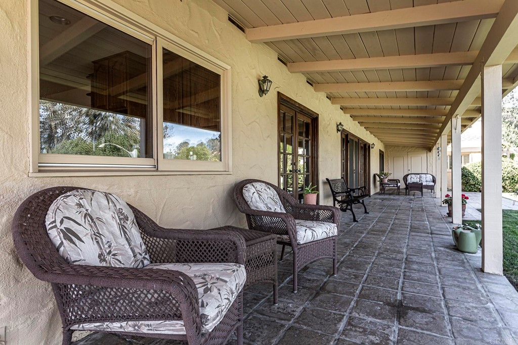 16854 Los Morros Rancho Santa Fe, CA 92067 - Photo 30 of 40 a living room with furniture and a window