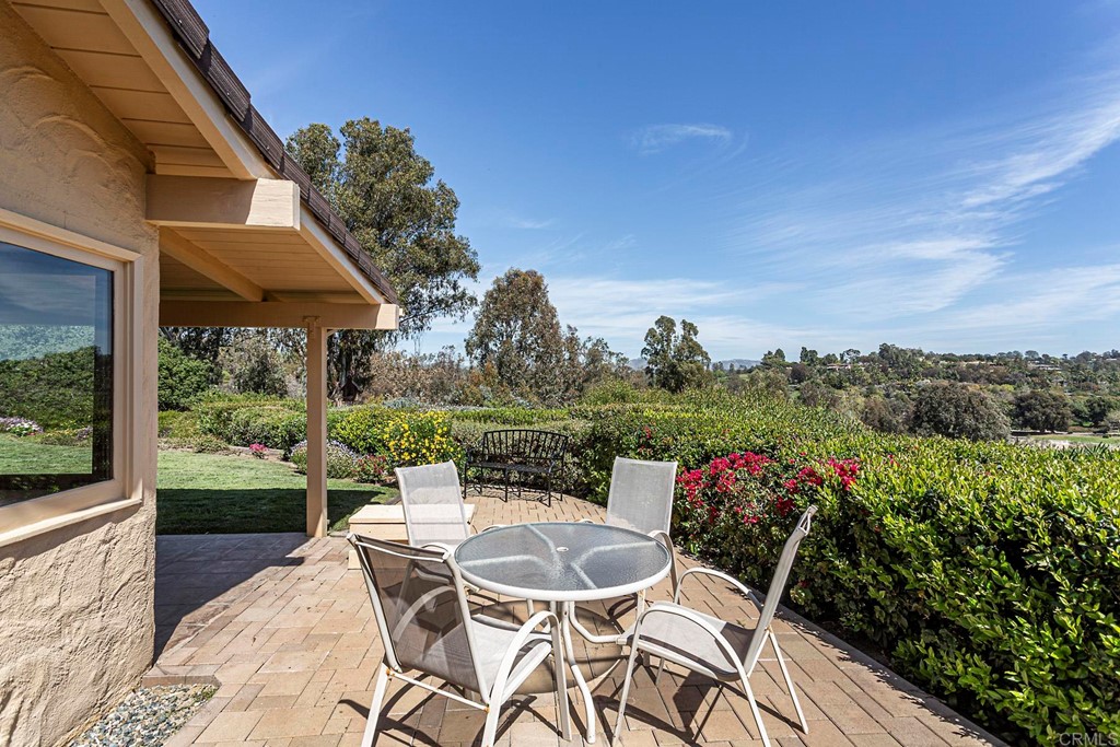 16854 Los Morros Rancho Santa Fe, CA 92067 - Photo 34 of 40 a patio with a table and chairs and potted plants
